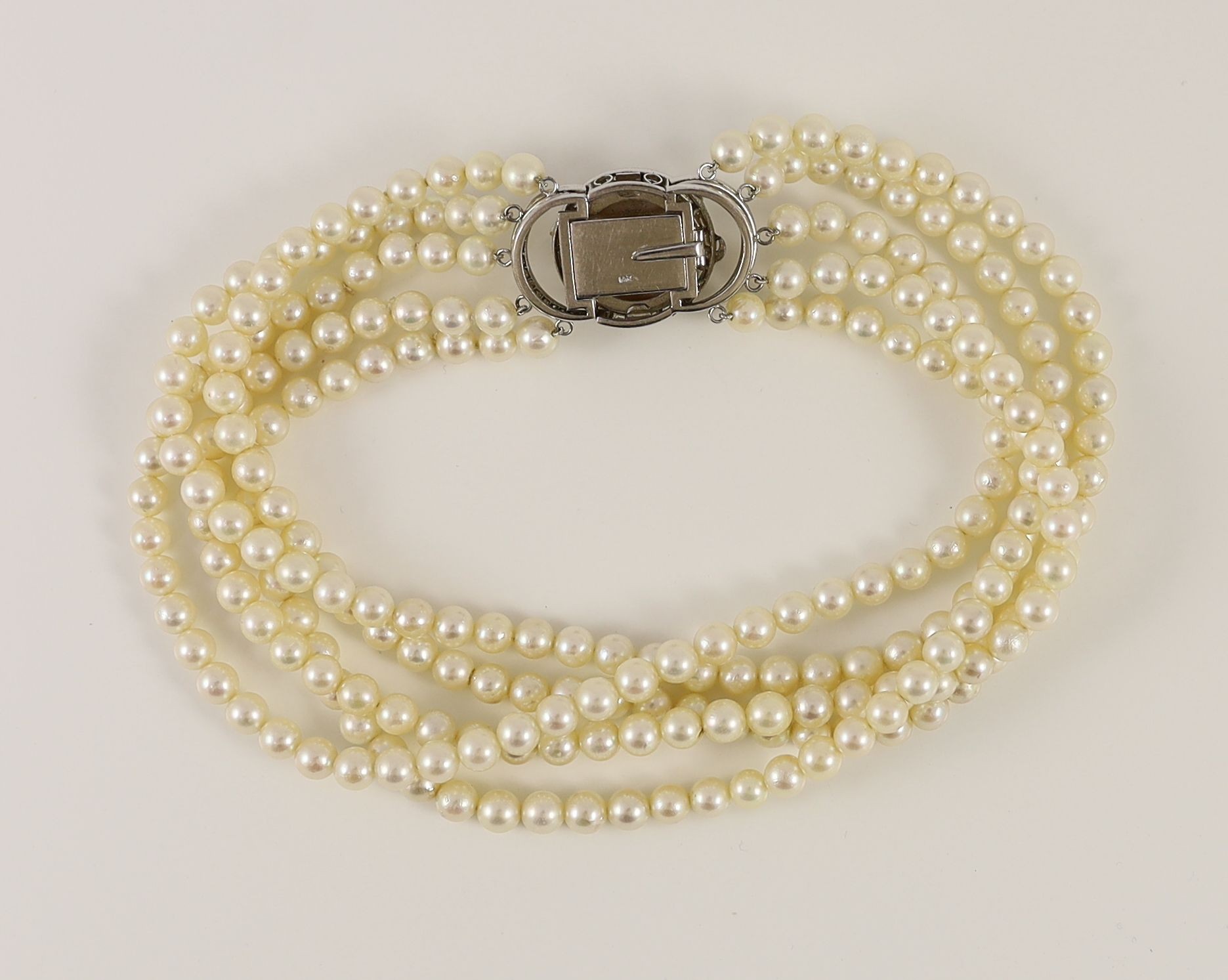 A 20th century quintuple strand cultured pearl choker necklace, with 14k, white gold and diamond set large mabe pearl clasp